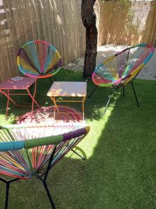 a group of chairs and tables in a yard at Finca Avrafina in Tarascon