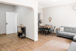 a living room with a couch and a table at Defne House Urla in Urla