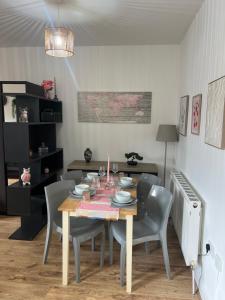 a dining room with a table and chairs at Stadium Solution Flat in London