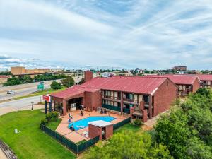 an aerial view of a building with a pool at The Lodge at the Falls in Wichita Falls