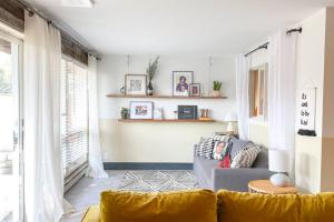 a living room with a couch and a window at Sunset Sanctuary in Steamboat Springs +40 photos