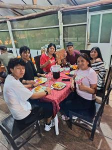 a group of people sitting around a table at Amazon Lodge Iquitos in Iquitos