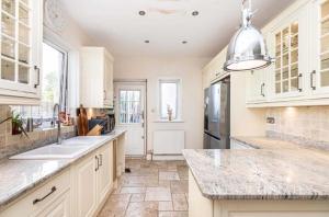 a kitchen with a sink and a counter top at Double rooms in shared house in Bournemouth +13 photos
