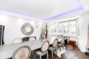 a dining room with a table and chairs at Double rooms in shared house in Bournemouth