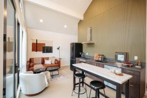 a kitchen with a table and chairs in a room at Frontcountry Salida in Salida