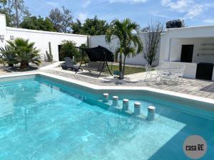 a swimming pool in front of a house at Casa RE Completa in Tehuacán +27 photos