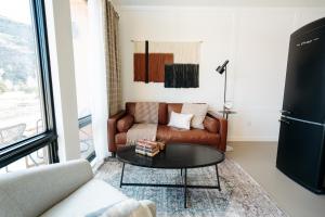 a living room with a couch and a table at Frontcountry Salida in Salida