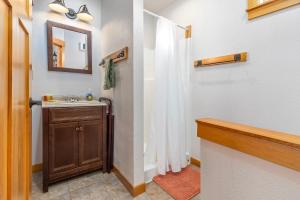 a bathroom with a sink and a mirror at Little Big Fish | Wifi, BBQ, AC ,Rainier View in Packwood +64 photos
