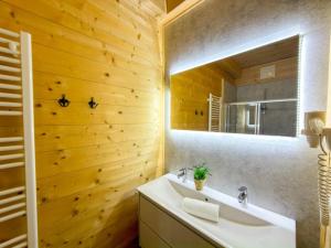 a bathroom with a sink and a mirror at Rattendorf 15B in Rattendorf +36 photos