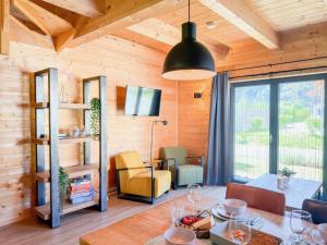 a living room with a table and a dining room at Rattendorf 15B in Rattendorf