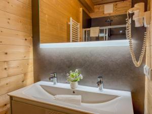 a bathroom with a sink and a mirror at Rattendorf 20A in Rattendorf +34 photos