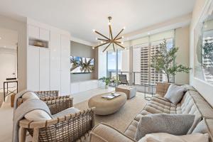 a living room with a couch and chairs and a table at Amrit Resort - Bask in Rare Oceanfront Luxury with Stunning Views in Riviera Beach