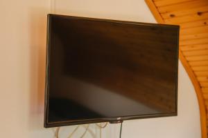 a flat screen tv hanging on a wall at Apartment Smoljanac 14979a in Smoljanac