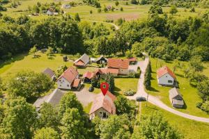 an aerial view of a house with a red sign on it at Apartment Smoljanac 14979b in Smoljanac