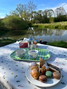 a table with a plate of pastries on it at The Sanctuary with private Jacuzzi in České Budějovice