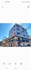 a rendering of a large apartment building at Suites e Kitnets praia Iriri in Anchieta