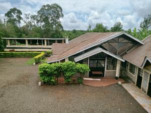 an image of a house with a roof at Scenic View Hotel and Resort in Thika