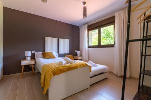 a bedroom with two beds and a window at NorthStyle by Fidalsa in Lanestosa