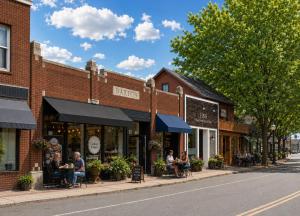 people sitting outside of a store on a street at Lakefront Glamping Cottage- Fishing-Swimming-Boating in Watertown +17 photos