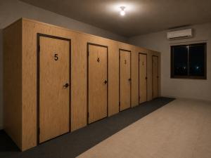 a row of wooden lockers in a room at The Cozy Cube in Rawalpindi