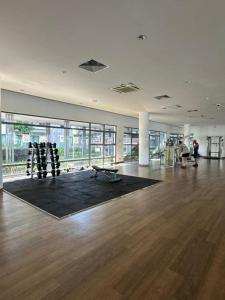 a large room with a gym with a bench in it at VH HOMES l Imago Mall l 2BR Family Suite l Garden Direct Access in Kota Kinabalu