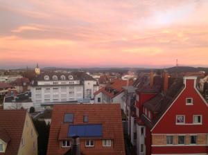 a view of a city at sunset at Apartment Lavendel nahe Polizeihochschule in Villingen-Schwenningen