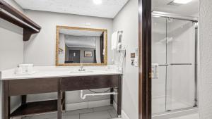 a bathroom with a sink and a shower at Super 8 by Wyndham Norman West OK in Norman