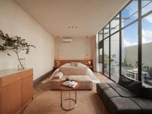a living room with a bed and a couch at Silver Beach Yuese Hostel in Beihai +116 photos