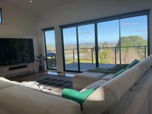 a living room with two couches and a television at Black Hill Retreat, Ballarat in Nerrina +15 photos