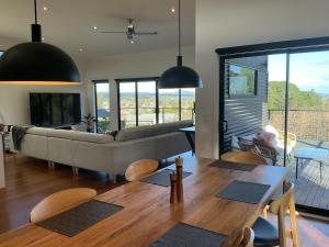a living room with a couch and a table at Black Hill Retreat, Ballarat in Nerrina