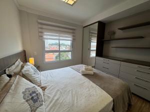 a bedroom with a large bed and a television at Casa Luna in Americana +32 photos