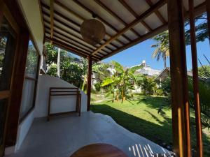 a view from the porch of a house at Kayu Cottage in Gili Trawangan +13 photos