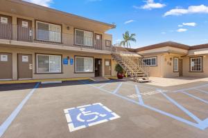 a building with a basketball court in a parking lot at Hotel 414 Anaheim in Anaheim