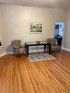 a living room with a table and two chairs at Robinsdale on broadway in Minneapolis