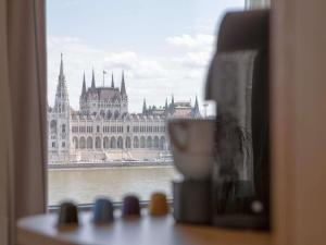 a view of the hungarian parliament building from a window at Novotel Budapest Danube in Budapest
