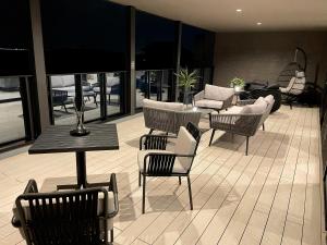 a room with chairs and tables in a building at CIN Garden Terrace in Futtsu