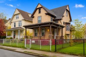 a house with a fence in front of it at Charming 3 Bdr Home 8 mins from the Falls in Niagara Falls
