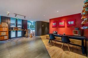 a room with a desk and two chairs in it at Citadines South Chengdu in Chengdu
