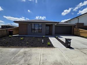 a house with a driveway in front of it at 11 Lomond street in Beveridge