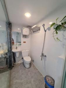 a bathroom with a toilet and a sink at SUN HOTEL in Hue +75 photos