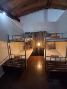 an overhead view of a room with three bunk beds at Grace Homestay in Somosomo