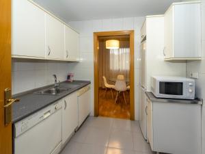 Kuchyňa alebo kuchynka v ubytovaní Gestión de Alojamientos Apartments