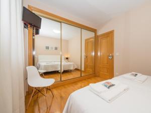 Posteľ alebo postele v izbe v ubytovaní Gestión de Alojamientos Apartments