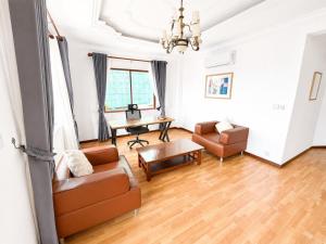 a living room with a couch and a table at WH302 Residence by WH in Phnom Penh