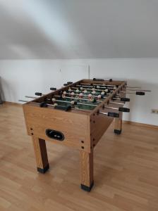 a large wooden table with a chessboard at Fränkische Schweiz Blick in Forchheim