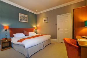 Ardington Hotel客房内的一张或多张床位