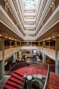 a large lobby with a large ceiling and a building at Aki Grand Hotel & Spa in Miyajima
