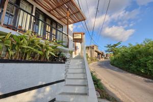 a set of stairs leading up to a building at Nalumi Villa in Nusa Penida