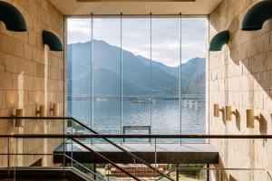 a large window in a building with a view of the water at Aki Grand Hotel & Spa in Miyajima