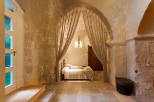 
a bedroom with a bed and a window at Casa Diva in Matera
